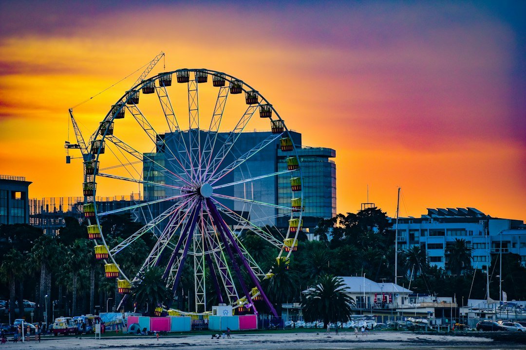 Illustrative stock photograph of a ferris wheel by the coast at sunset, not the proposed Brighton Wheel