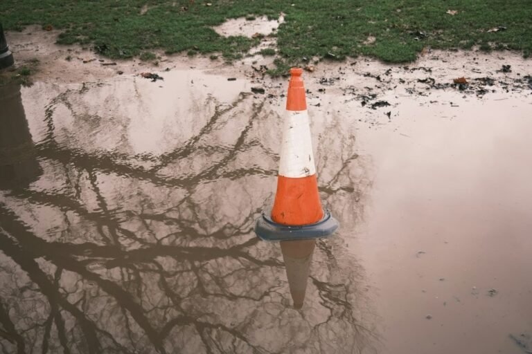 Traffic cone standing in floodwater, illustrating the A259 Peacehaven burst water main disruption