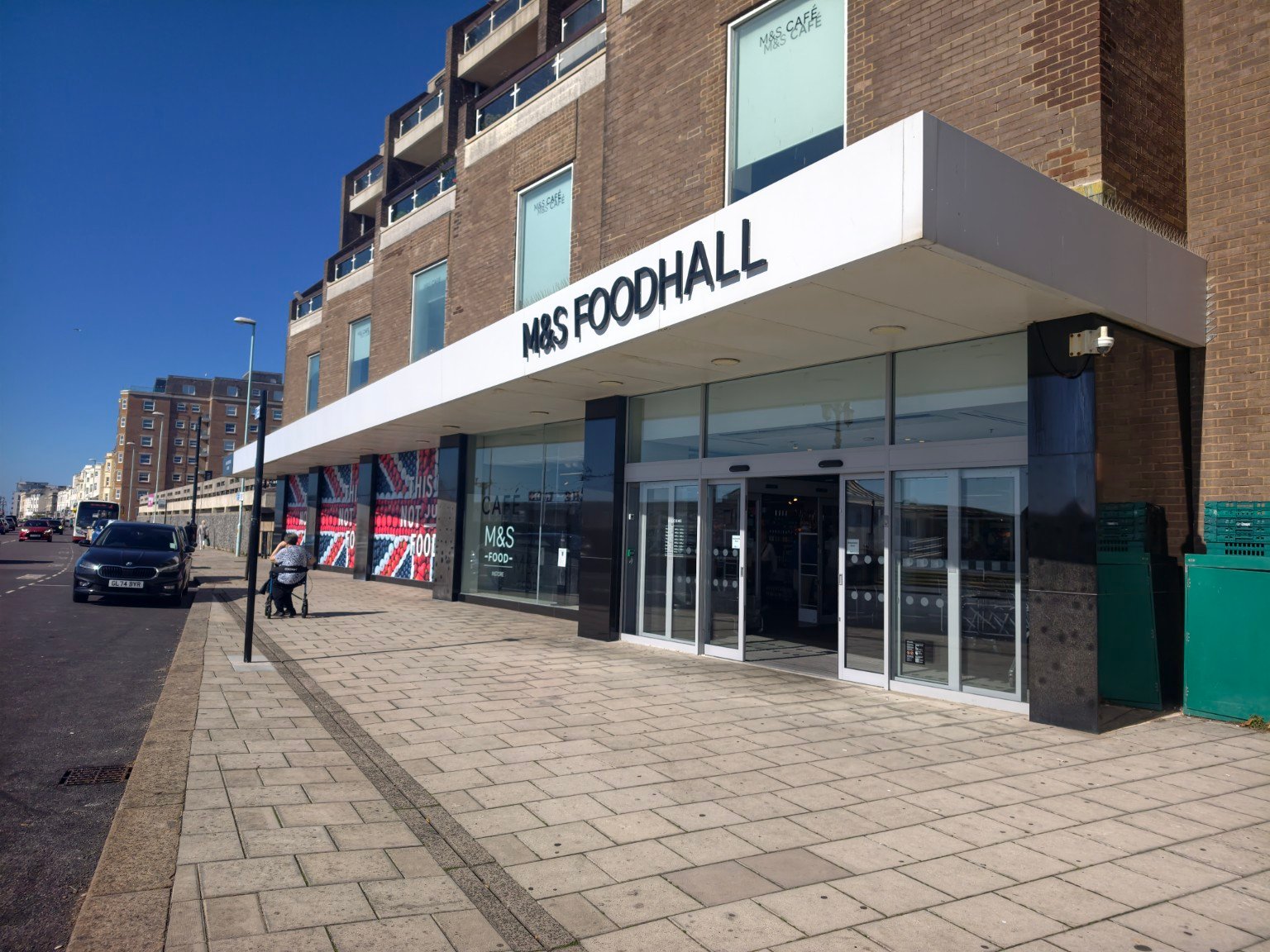 M&S Foodhall entrance in Worthing town centre on a sunny day
