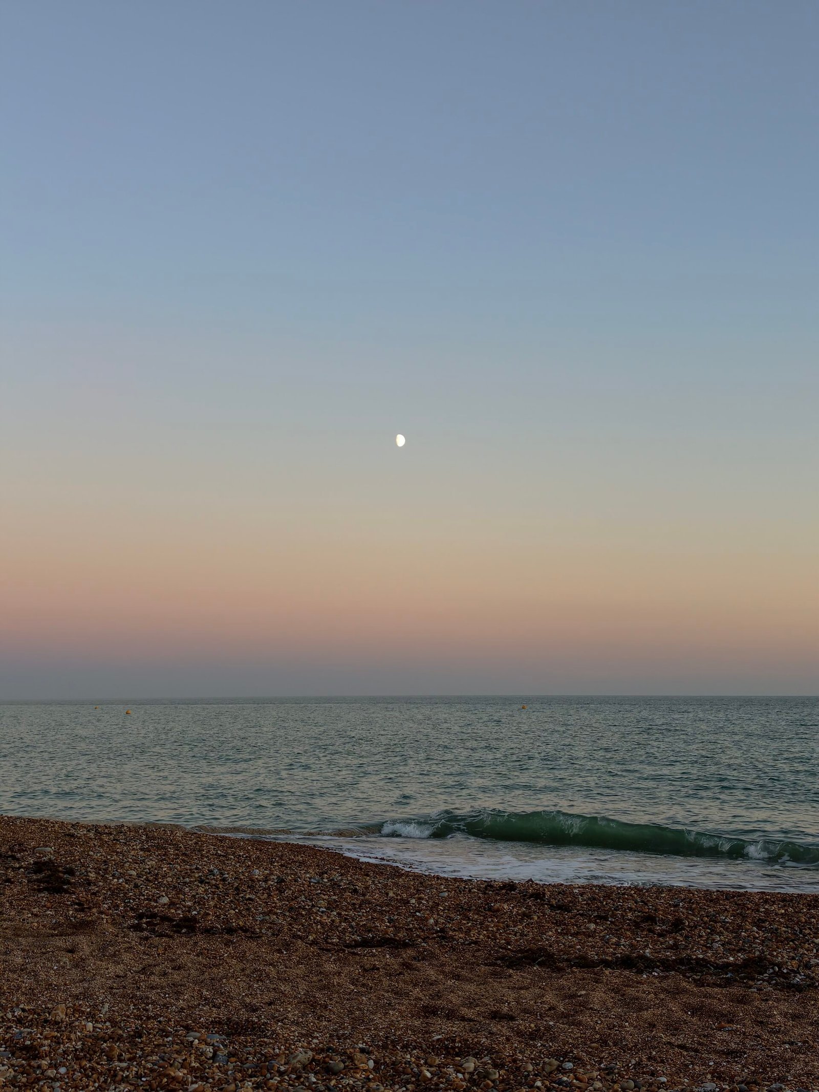 Moon above Hove seafront at sunset, photographed by Brighton Locals