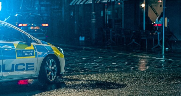 Illustrative stock photograph of a police vehicle at night, not the Seaford shopfront crash