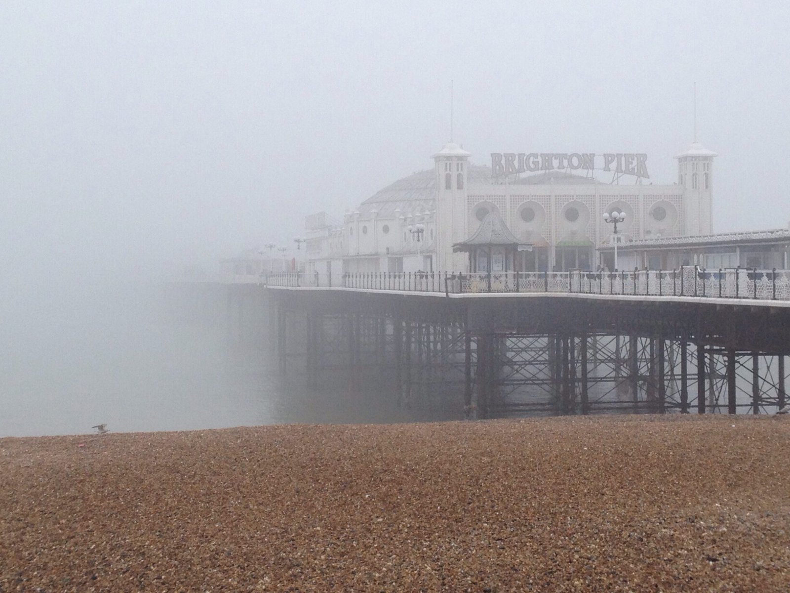 Archive photograph of sea fog around Brighton Pier on 14 March 2014; not current weather or a forecast for October 2026.