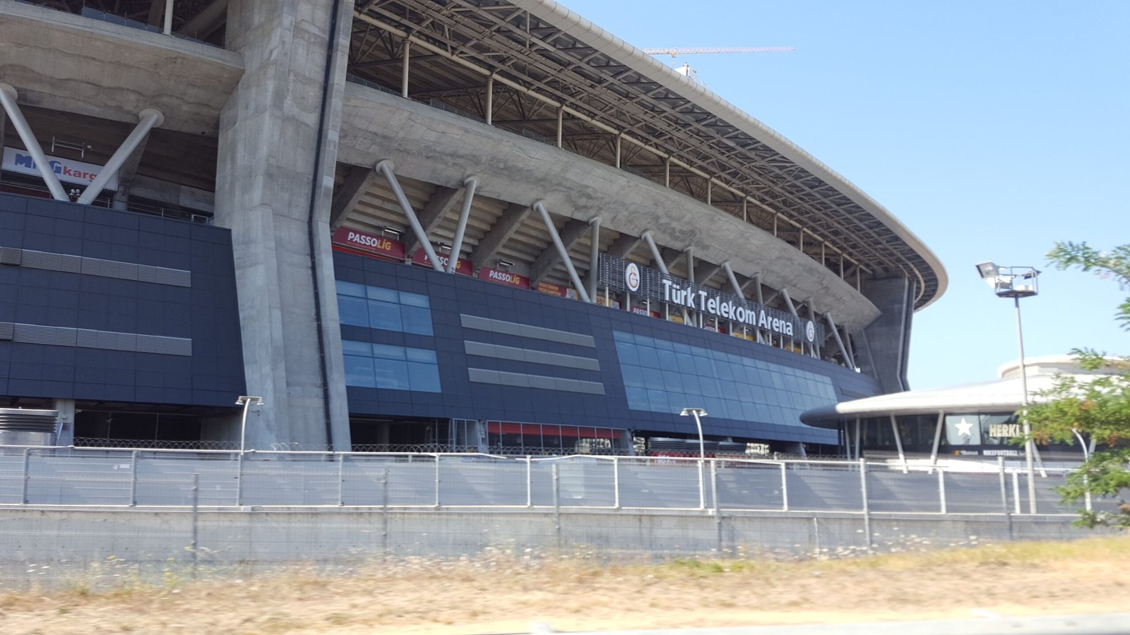 Archive exterior photograph of Galatasaray's stadium in Istanbul, then called Turk Telekom Arena, taken 11 August 2016; not the Barcelona match on 13 October 2026.